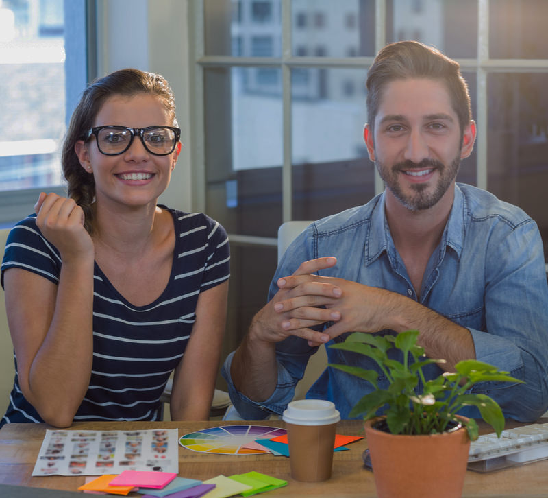Male and female web designers in the AllMediaLab studio